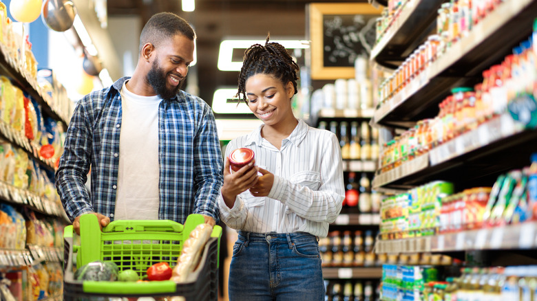 two people shopping for groceries