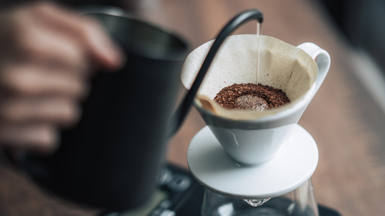 Person making pour-over with gooseneck kettle