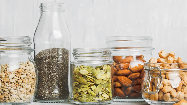 Nuts and seeds in glass jars