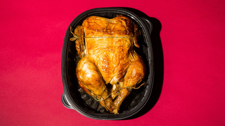 Rotisserie chicken in black container