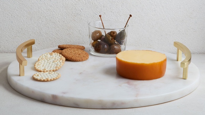 Marble cheese board with snacks