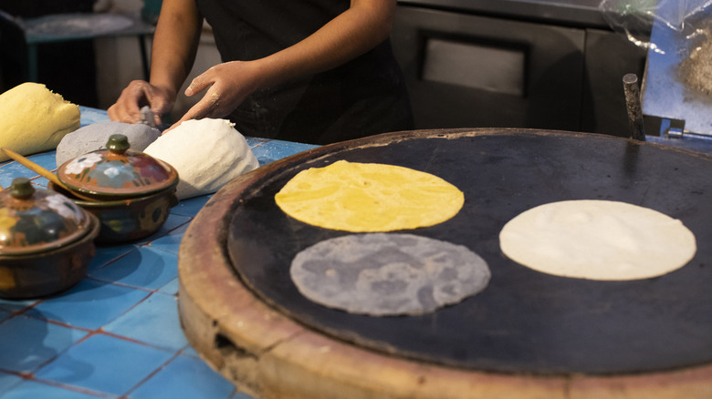 Making corn tortillas 