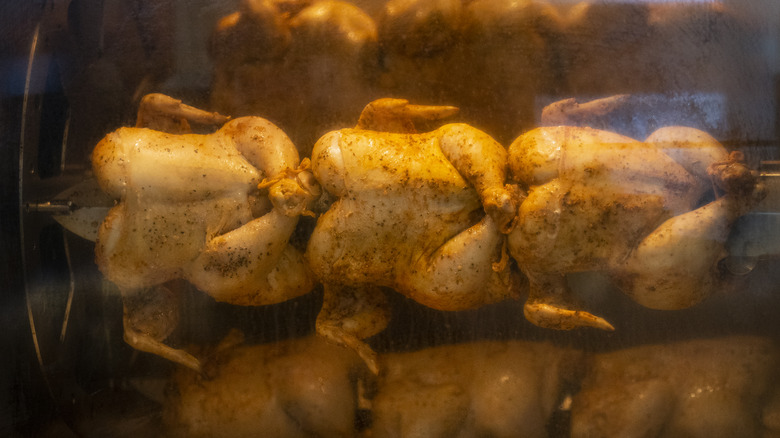 Rotisserie chickens on rack