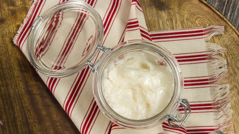 Jar of grease on table 