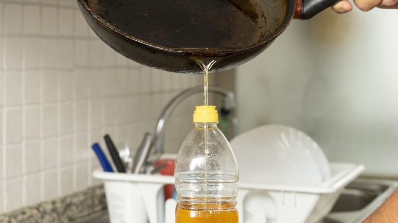 Pouring oil from pan to bottle