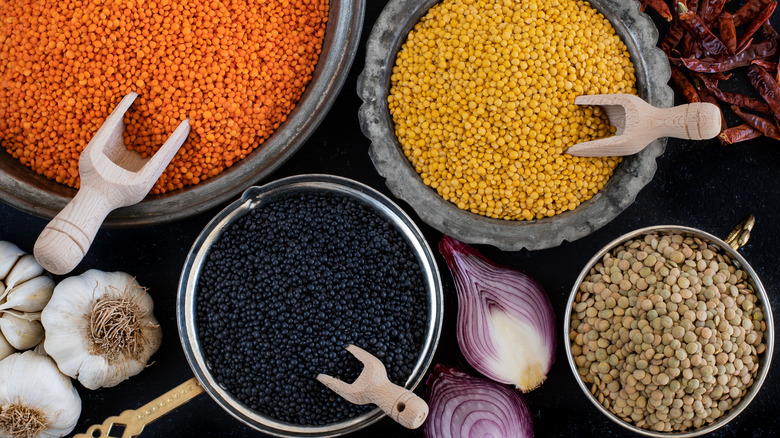 multicolored dry lentils in pots
