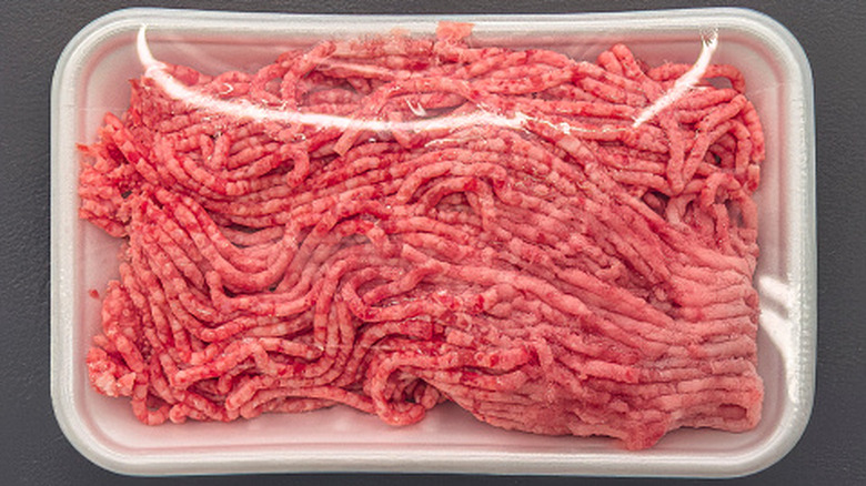Ground beef in plastic container