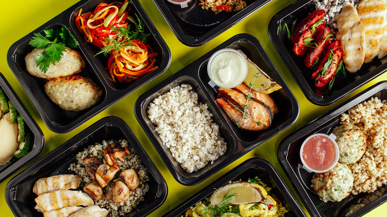 Meals prepped in black containers