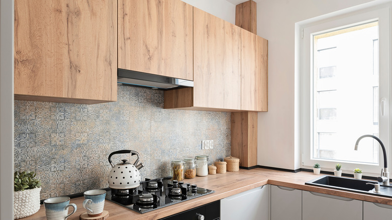 Interior of home kitchen with clean wood cabinets