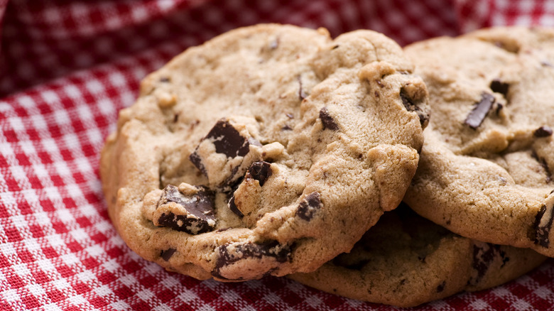 Chocolate chip cookies on a gingham cloth
