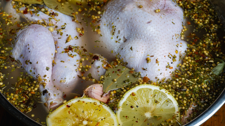 Raw chicken in brine solution