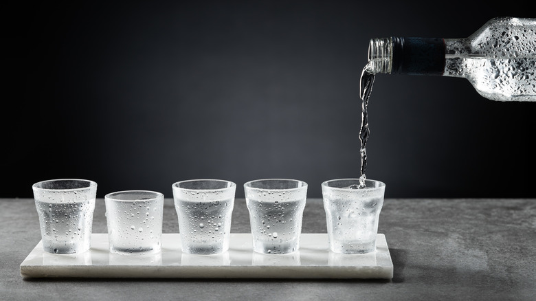 Shots of vodka being poured