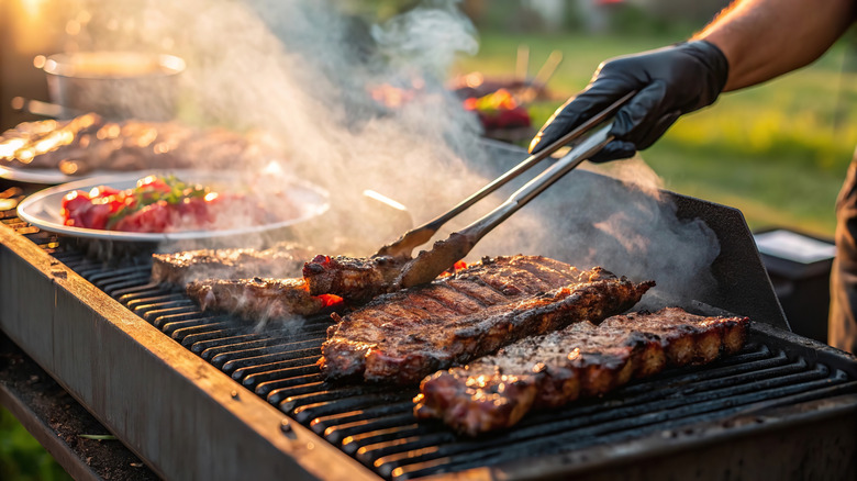 Grilling ribs and vegetables at a backyard barbecue