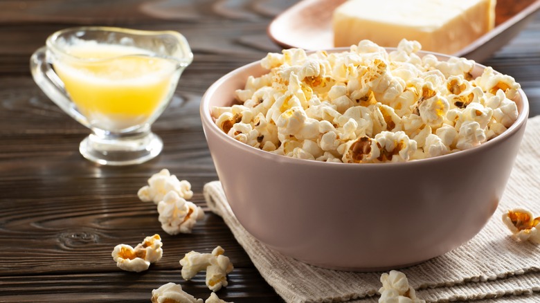 melted butter and bowl of popcorn