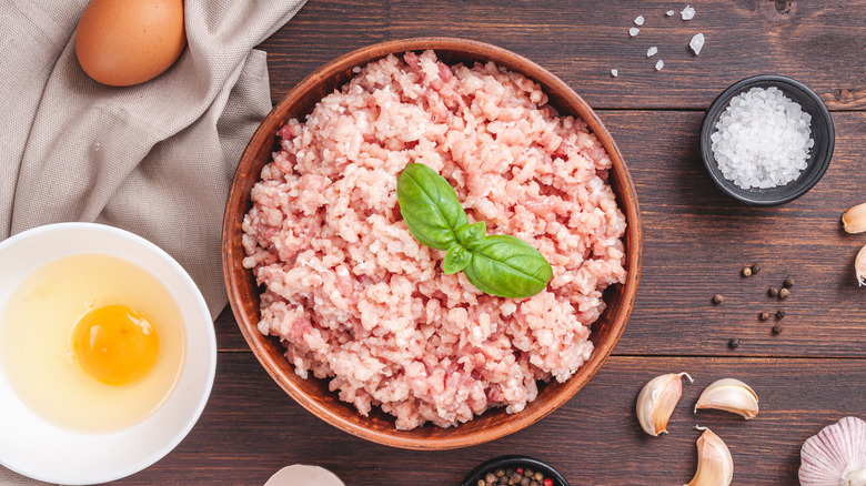 Ground chicken on wooden board