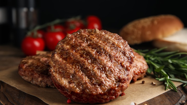 Cooked burger patties on a piece of wax paper