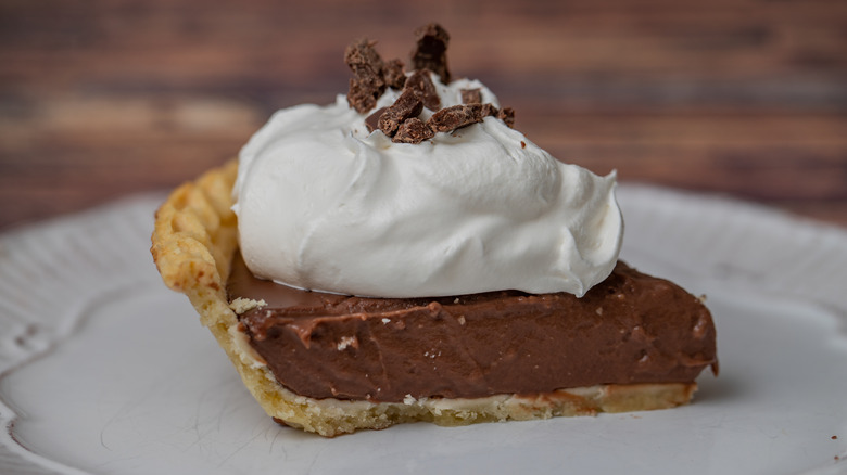 Slice of chocolate cream pie on plate