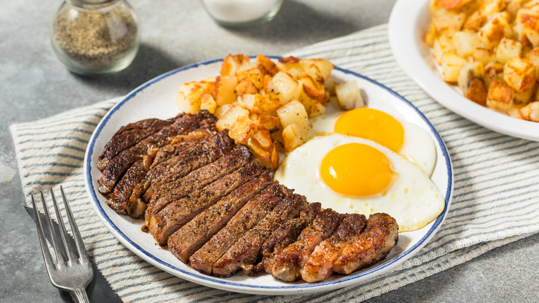 Steak and eggs on a dish