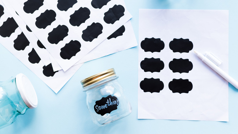 Chalkboard sticker sheets by jar labeled "something"