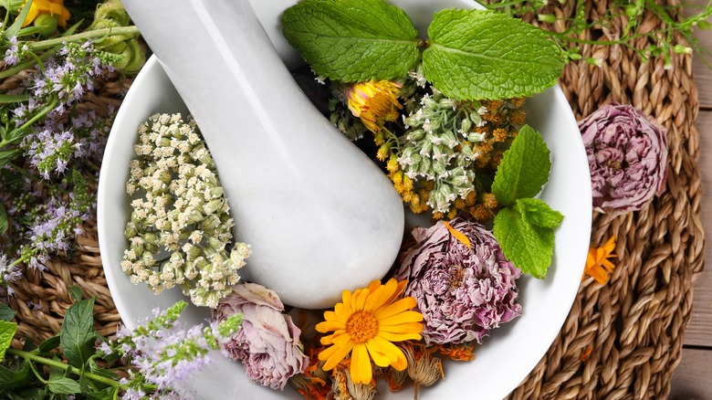 Mortar and pestle with herbs