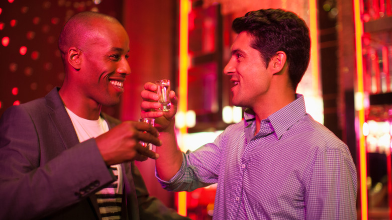 Two men doing shots