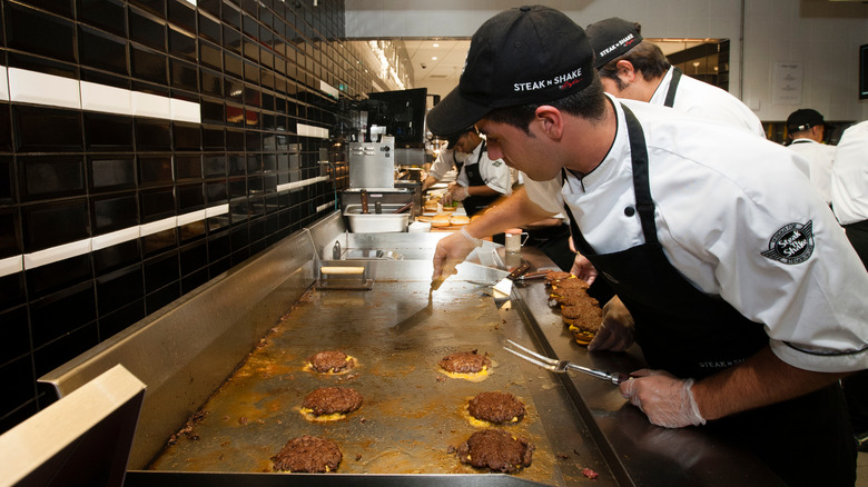 Steak 'n Shake cook making burgers