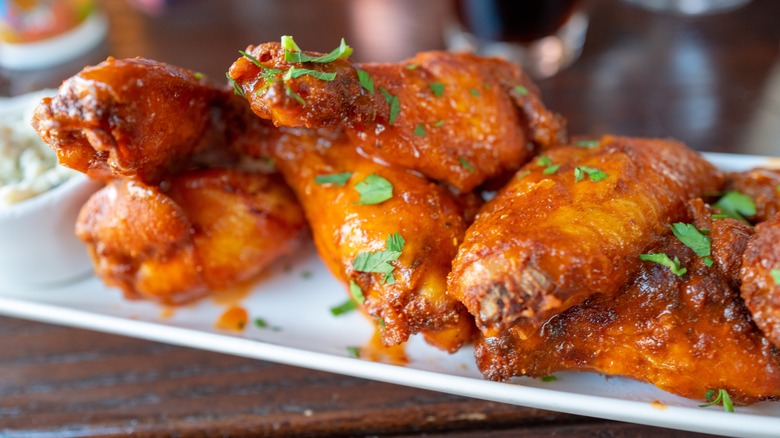 Plated Buffalo wings with garnish