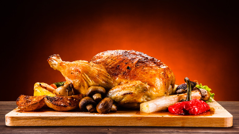 Roasted chicken on cutting board