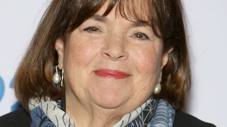 Ina Garten with wide smile and pearl earrings
