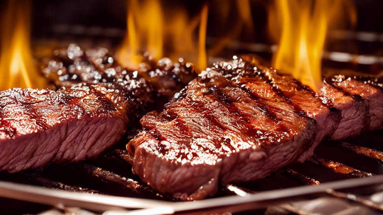 steaks on a grill