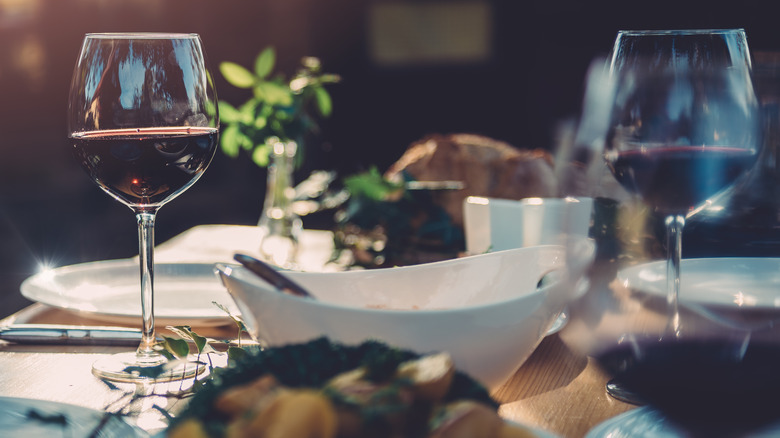 Wine glasses and dishes on table
