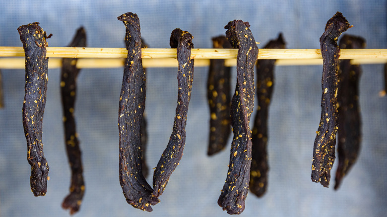 Biltong drying on sticks