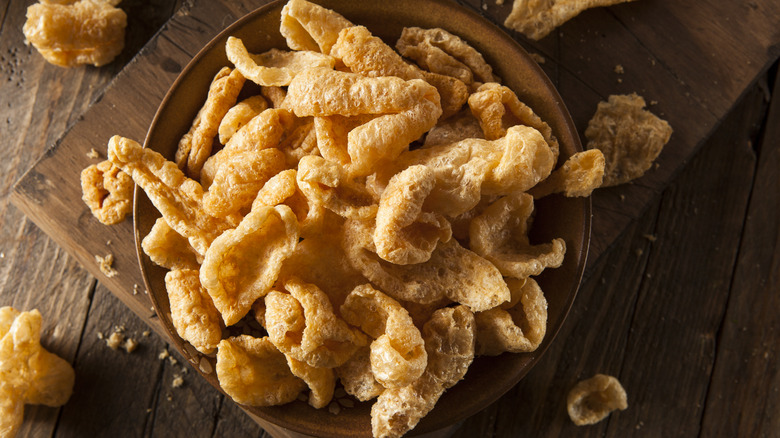 pork rinds in wooden bowl