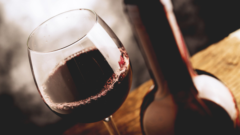 Red wine glass and bottle