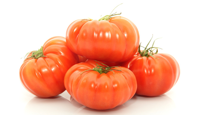 Beefsteak tomatoes stacked on top of one another 