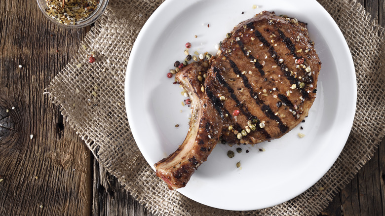 Grilled steak on a white ceramic plate