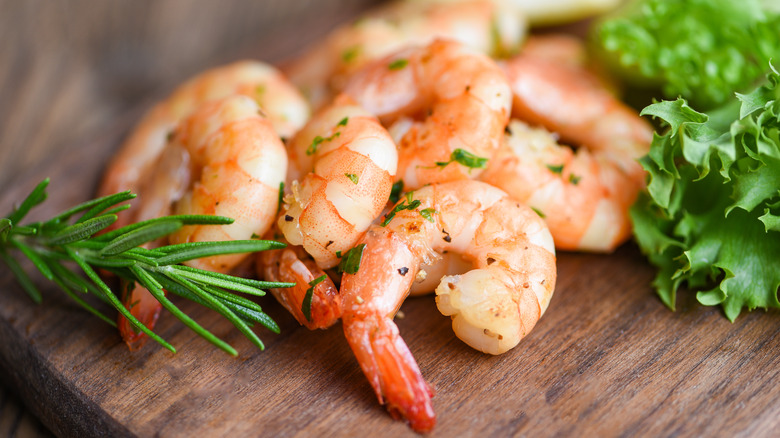 Cooked shrimp on cutting board 