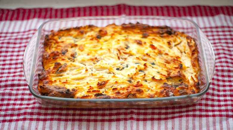 Casserole in a glass dish on picnic blanket