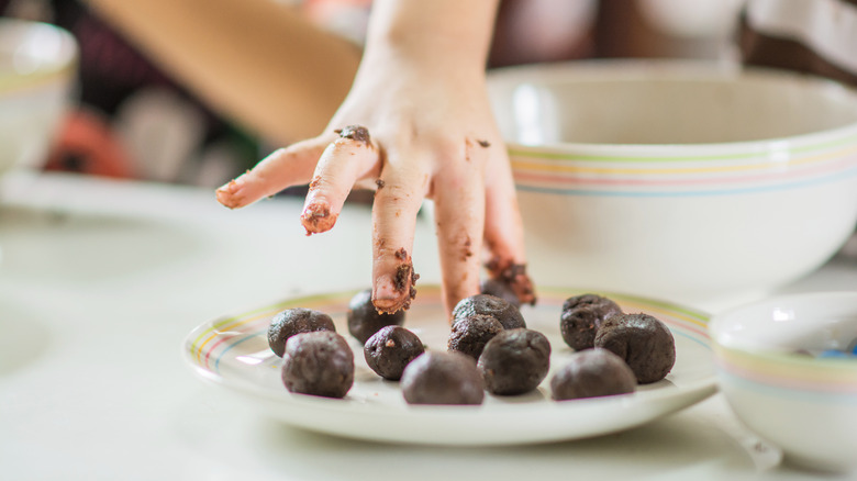 child making cake pops