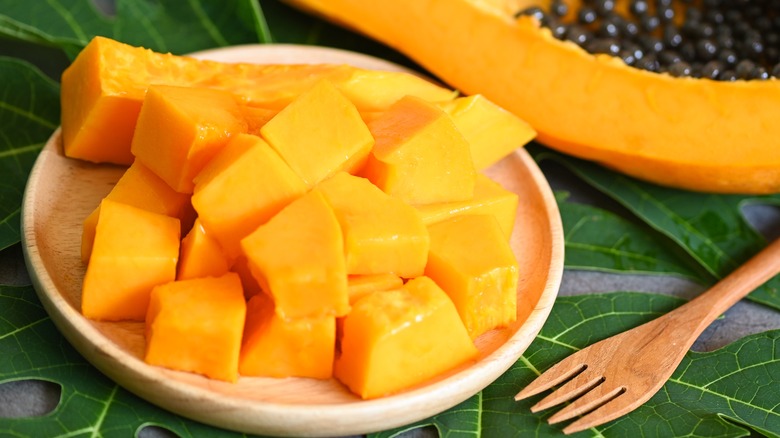 Papaya slice with seeds and cubes