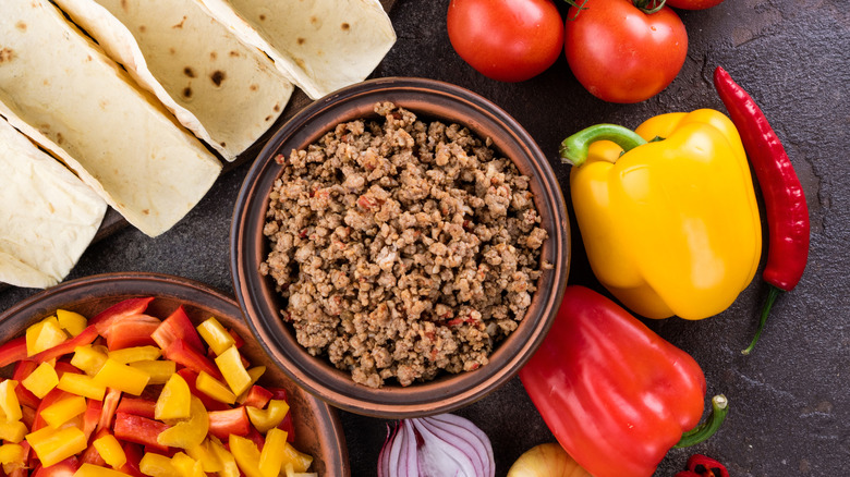 taco night spread with bowl of ground taco meat