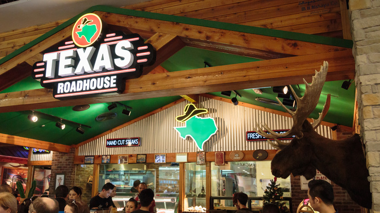 Interior shot of a Texas Roadhouse sign and restaurant counter
