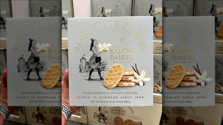 a person holding up karens bakery danish puff pastries