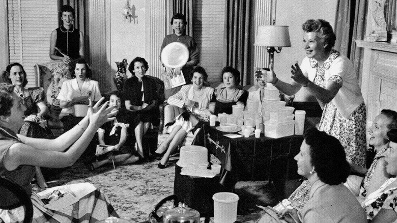 Brownie Wise tosses Tupperware in a party demonstration