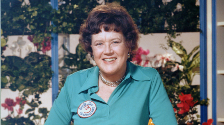 Portrait photo of Julia Child wearing a green shirt.