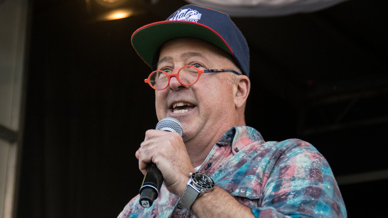 Andrew Zimmern in orange glasses