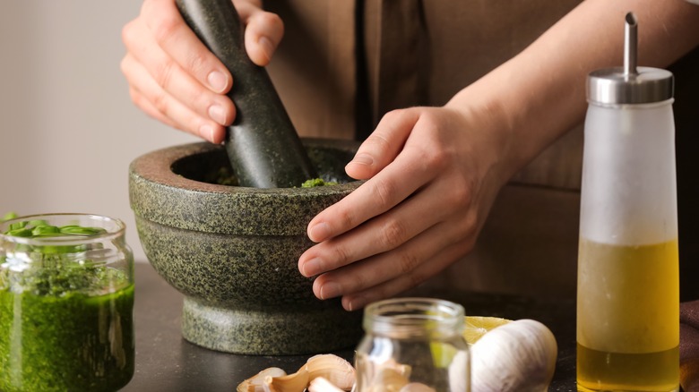 mortar and pestle with pesto