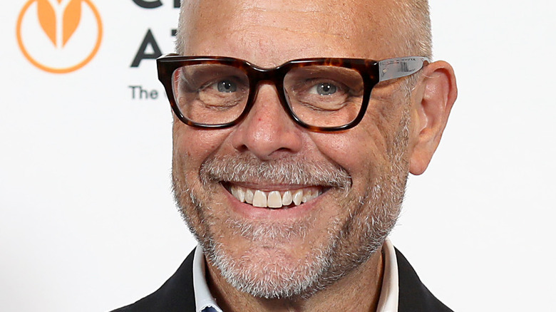 Alton Brown smiles with glasses
