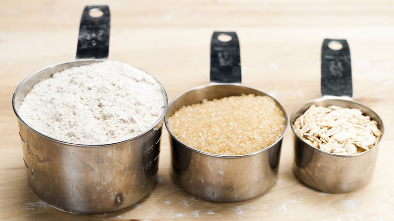Various filled measuring cups