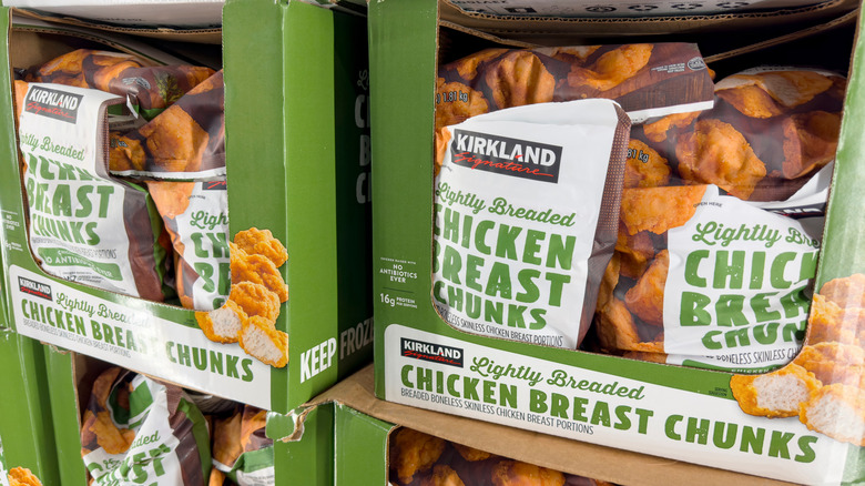 Bags of Kirkland Signature lightly breaded chicken chunks in a Costco freezer